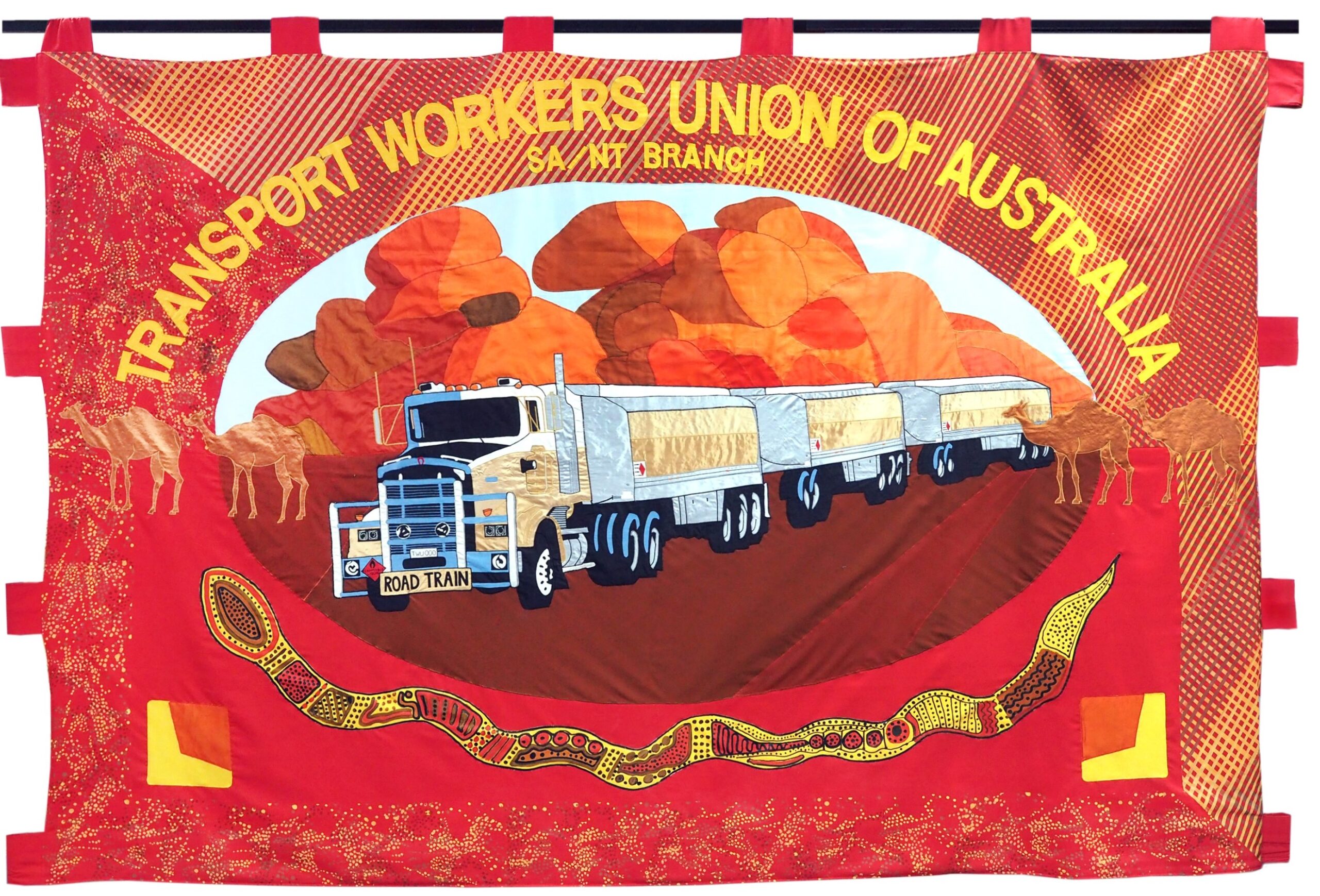 TRANSPORT WORKERS UNION OF AUSTRALIA SA NT BRANCH
(Held in Darwin Office of the Transport Workers Union of Australia SA NT Branch)
Artists: Designed and made by artist Joanna Barrkman with the assistance of First Nations artist Christina Yambeing (from Merrepen Arts)
Produced: 1996
Loaned by the Transport Workers Union of Australia SA NT Branch